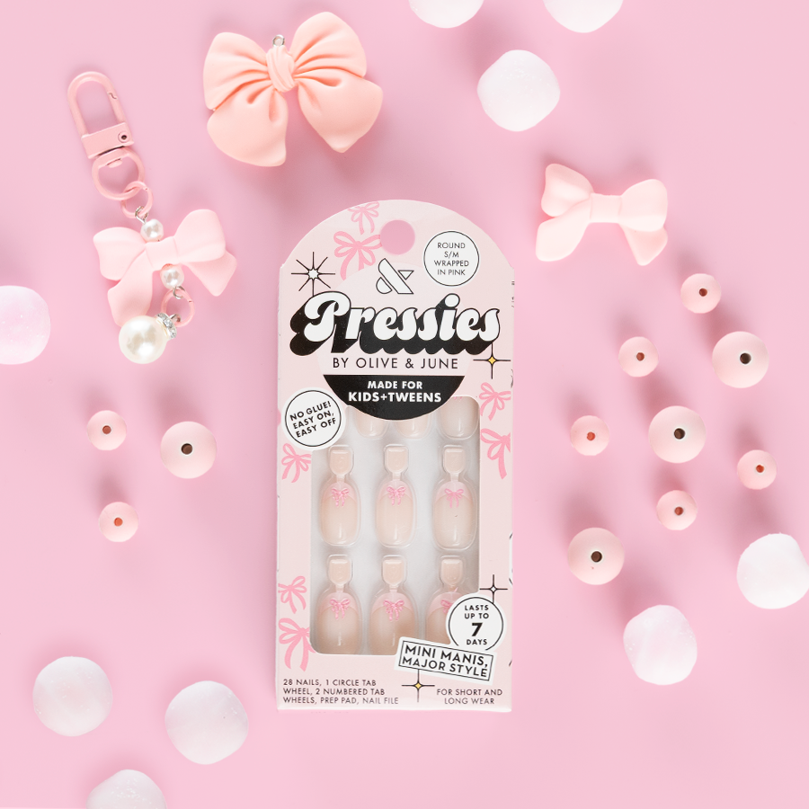 Wrapped in Pink - Pressies | Short Medium | Round showing baby pink french press on nails with 3D bow detail in packaging