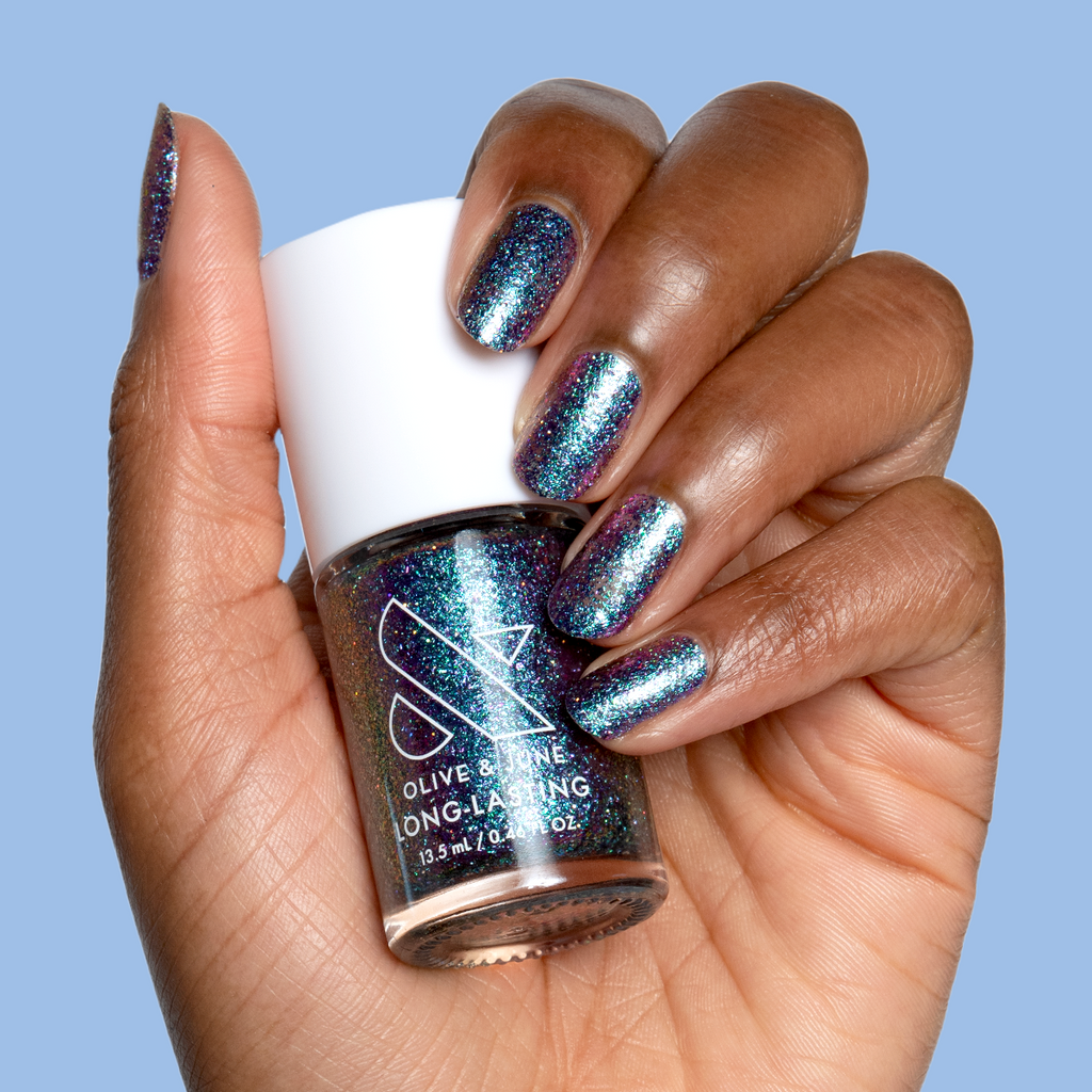 You Obviously Need It iridescent glitter polish with purple-blue shift on natural nails for a sparkling manicure