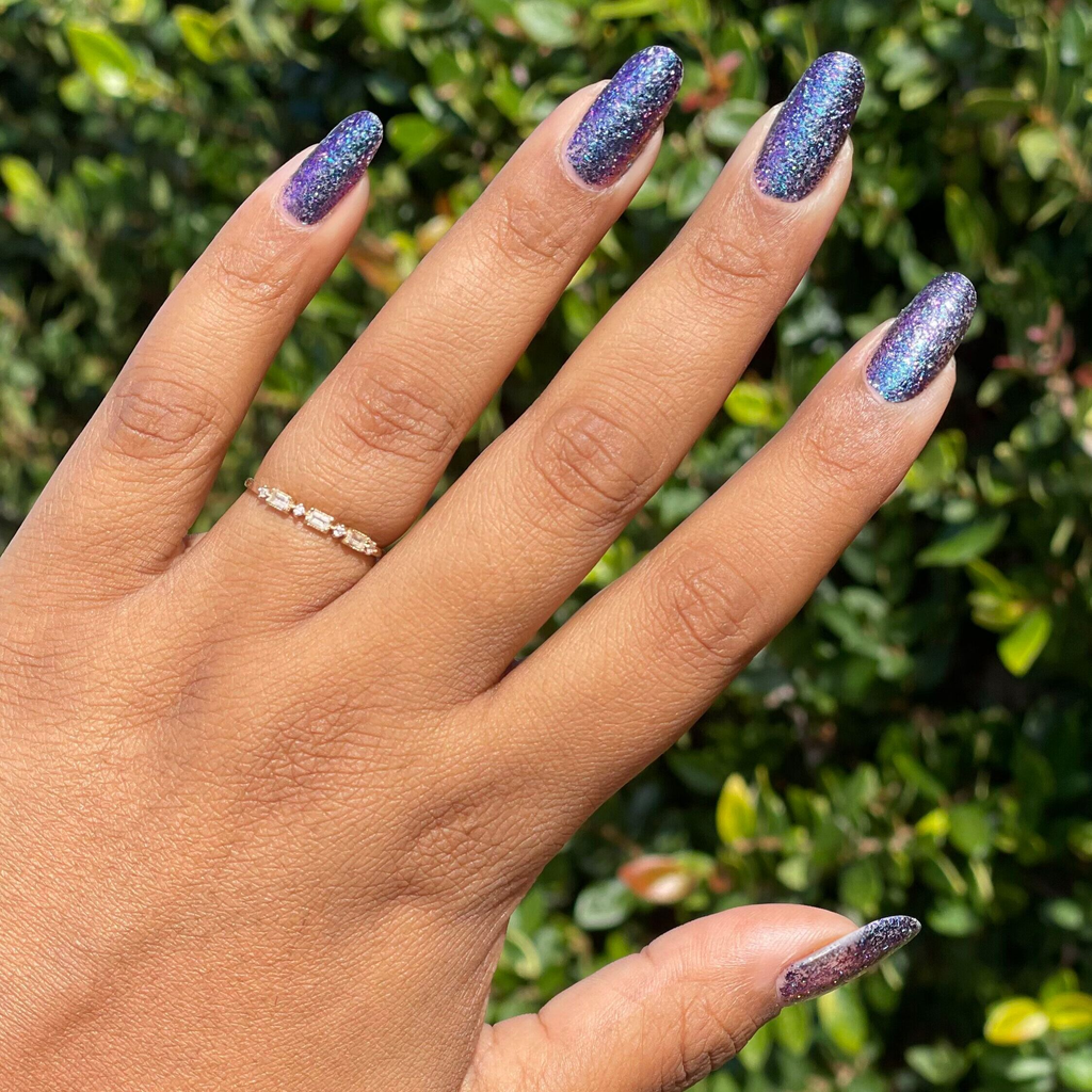 You Obviously Need It iridescent glitter gel polish with sparkling purple-blue shimmer on natural medium-length nails