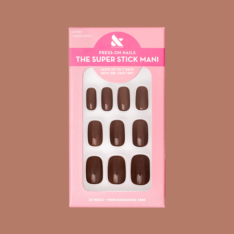 Americano | Short | Squoval - Tab Press-On showing a set of glossy coffee brown false nails in pink packaging on neutral background