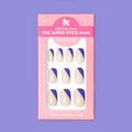 Asymmetrical French | Short | Squoval - Tab Press-On nails with indigo diagonal tip on neutral base in pink packaging
