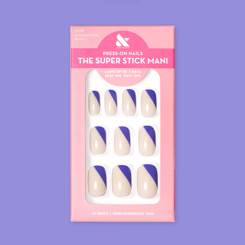 Asymmetrical French | Short | Squoval - Tab Press-On nails with indigo diagonal tip on neutral base in pink packaging