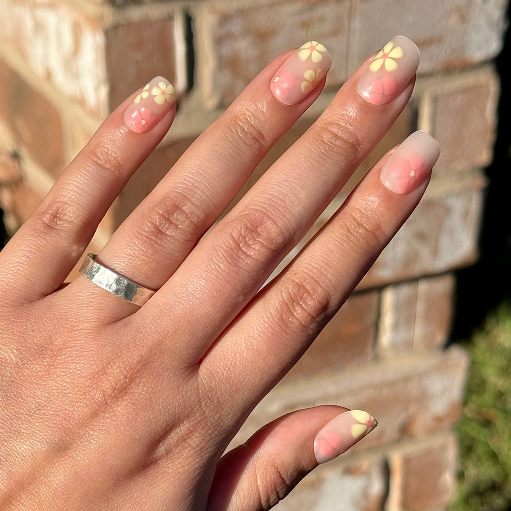 Blooming Floral - Press-On | Short | Squoval sheer neutral nails with soft yellow floral accents for easy at-home manicure