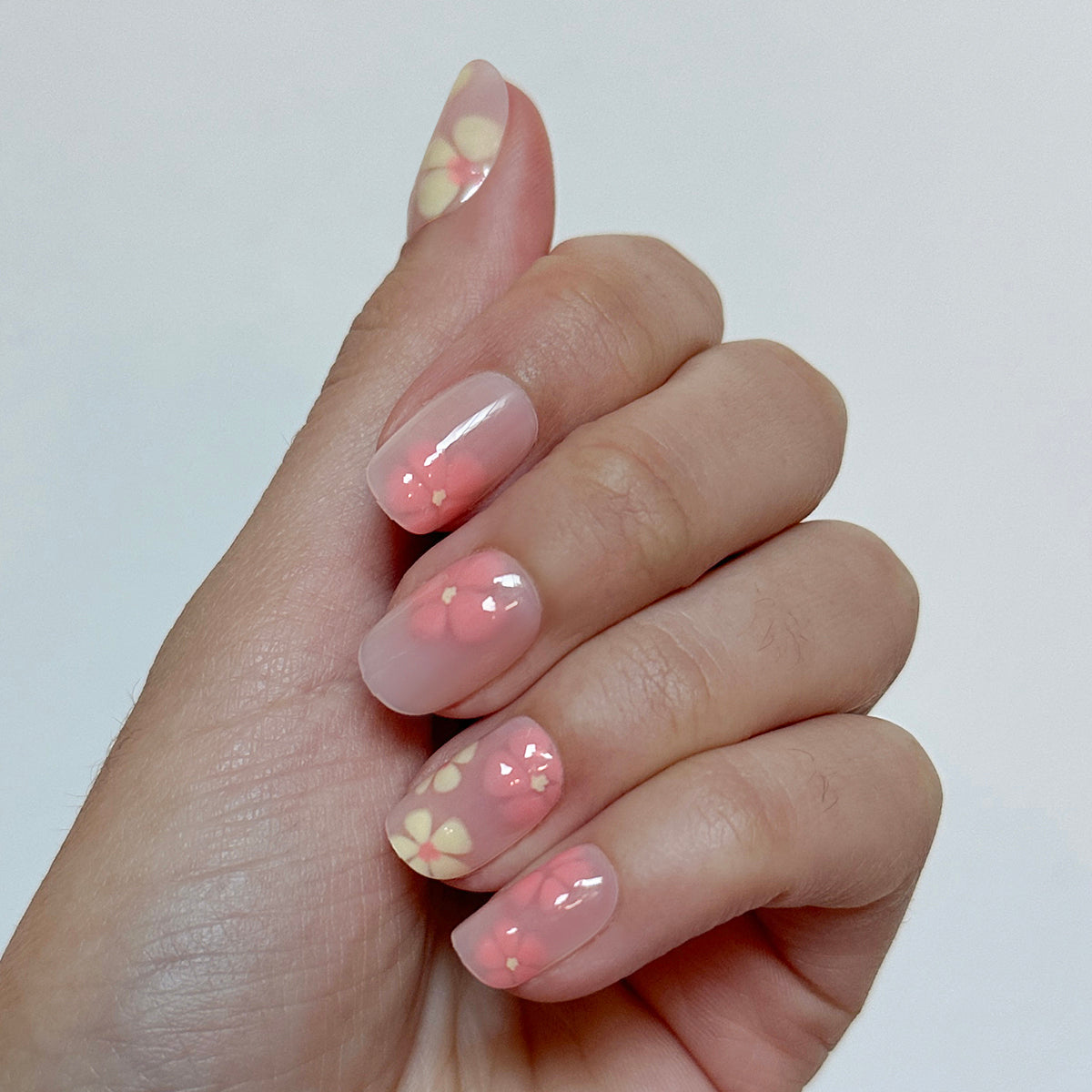 Blooming Floral - Press-On | Short | Squoval sheer short squoval nails with soft pink and cream floral designs for quick mani