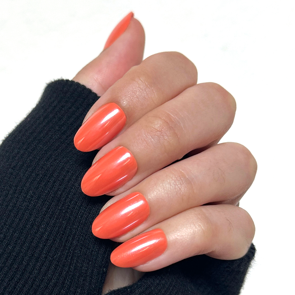 Bounce Back Chrome - Press-On | Medium | Oval medium oval bright tangerine orange press-on nails with chrome shimmer on hand