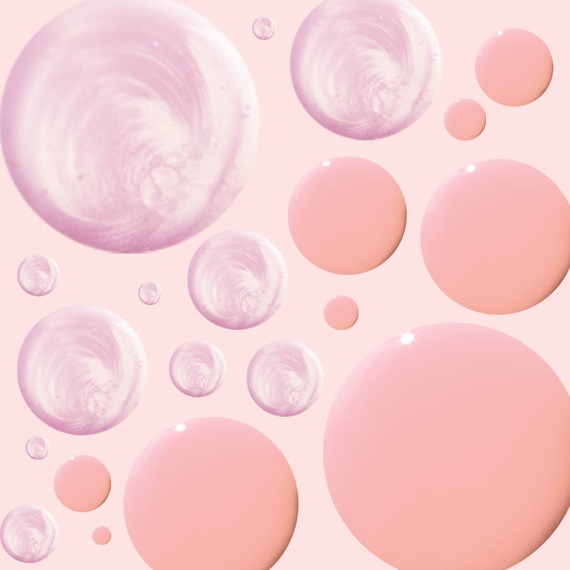 Close-up of pink and shimmery polish droplets arranged randomly on pale background for Candy Shoppe mani display