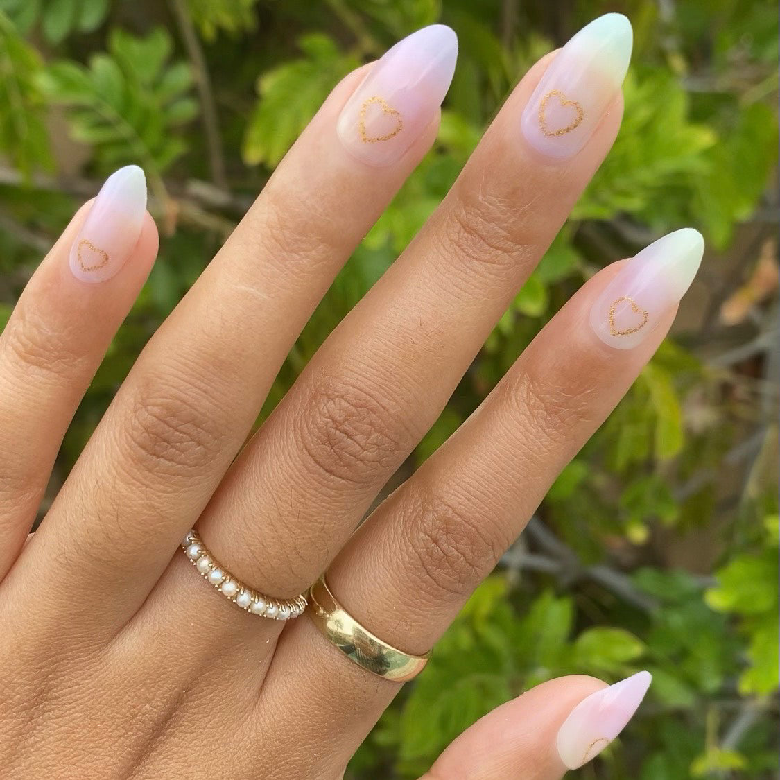 Glitter Heart Ombre | Almond | Medium press-on nails with soft pastel rainbow ombre and delicate gold heart outline manicure