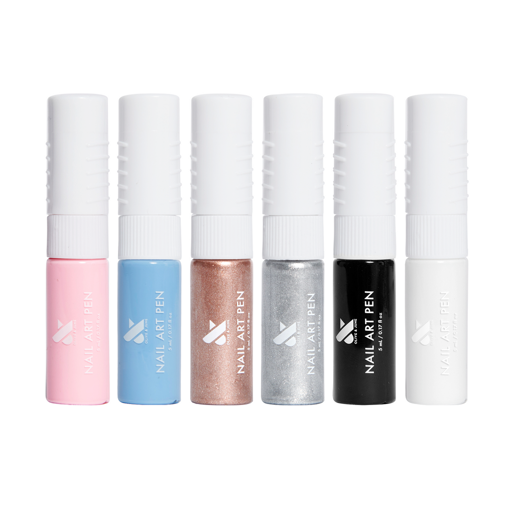 Set of six Nail Art Pens in pastel, metallic, black, and white shades for creating detailed at-home manicures