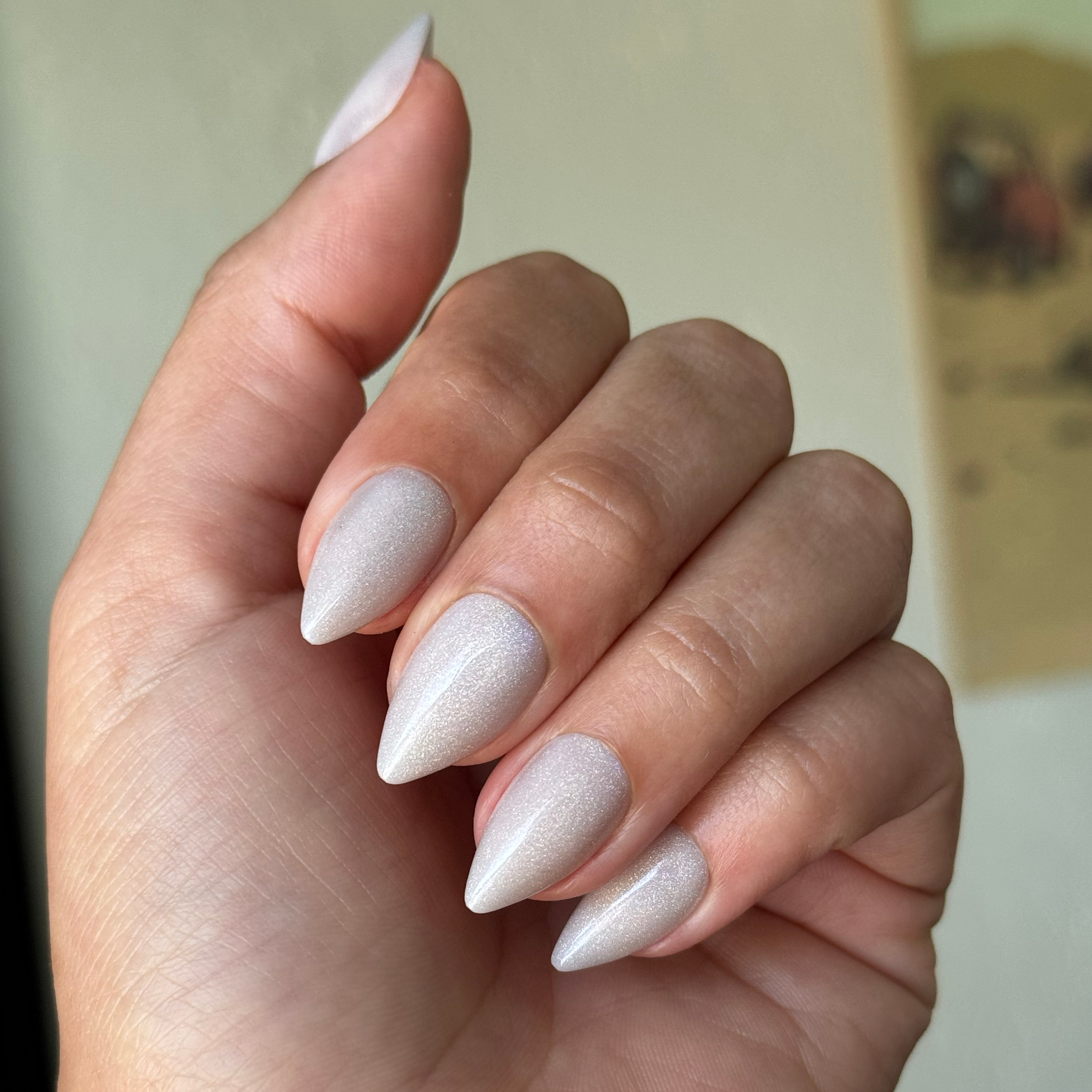 Neutral Iridescent Velvet - Press-On | Medium | Stiletto nails with shimmering velvet finish on hand indoors