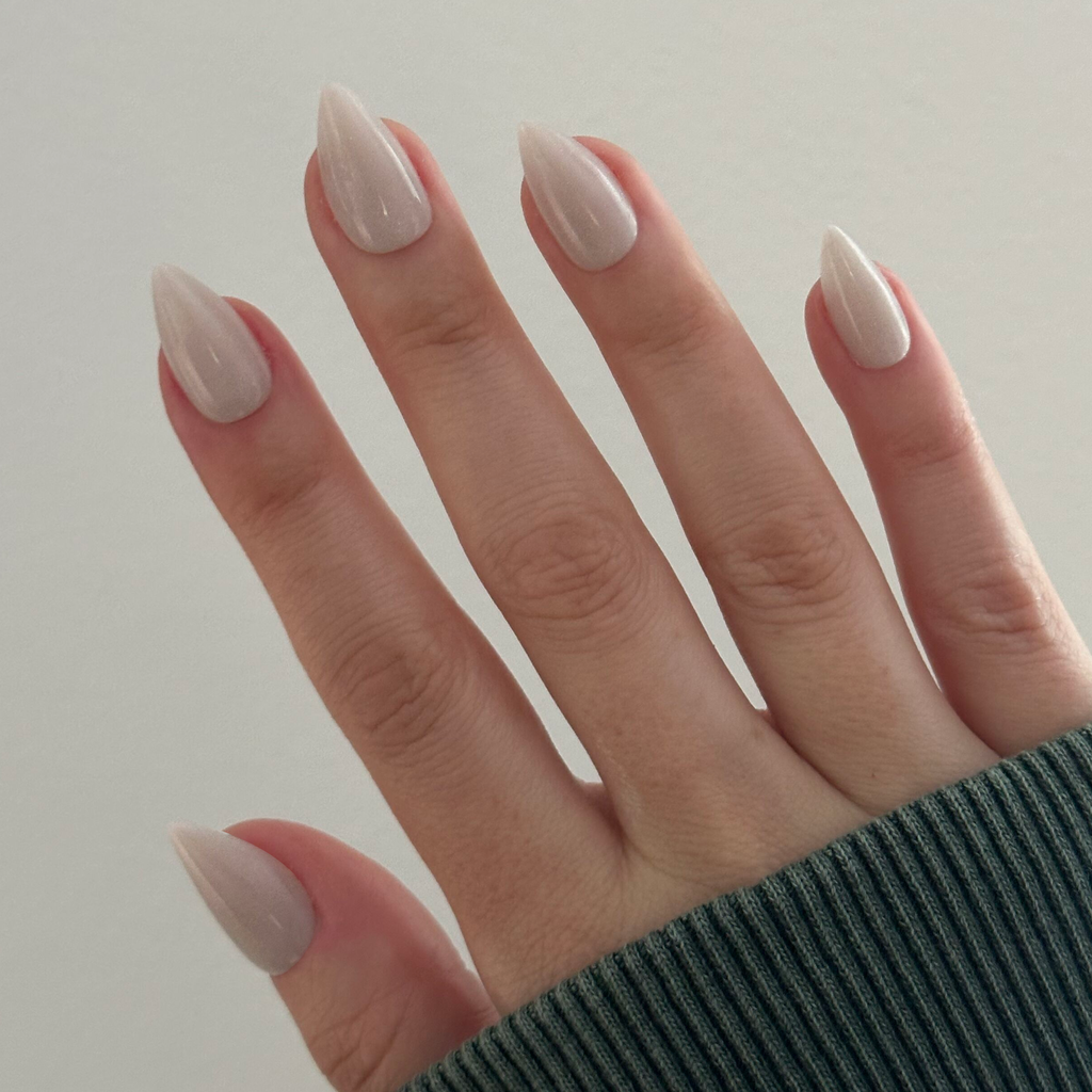 Neutral Iridescent Velvet - Press-On | Medium | Stiletto nails with soft shimmer worn on hand with knit sleeve background