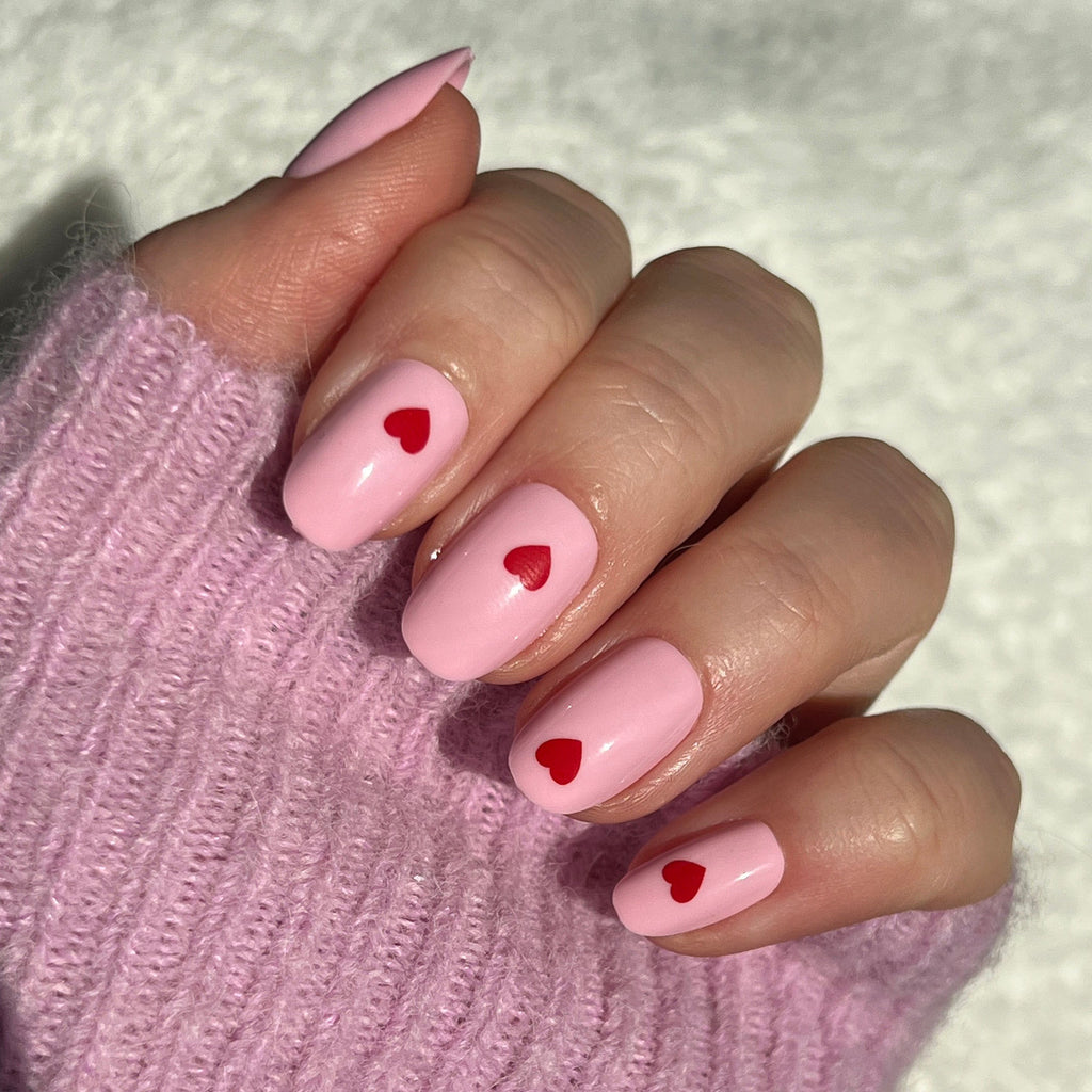 Pink Perfect Heart - Press-On | Round | Short with soft pink base and single red heart design on natural nails