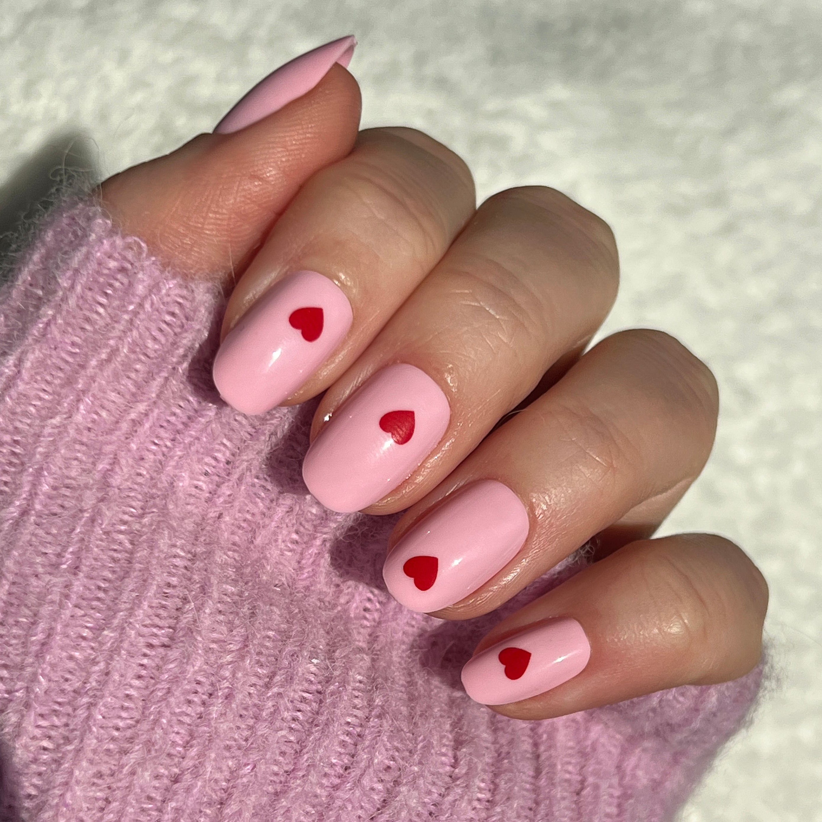 Pink Perfect Heart - Press-On | Round | Short with soft pink base and single red heart design on natural nails