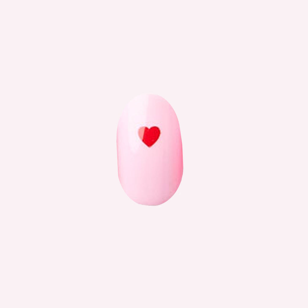 Pink Perfect Heart - Press-On | Round | Short with soft pink base and single red heart nail design for quick at-home mani.