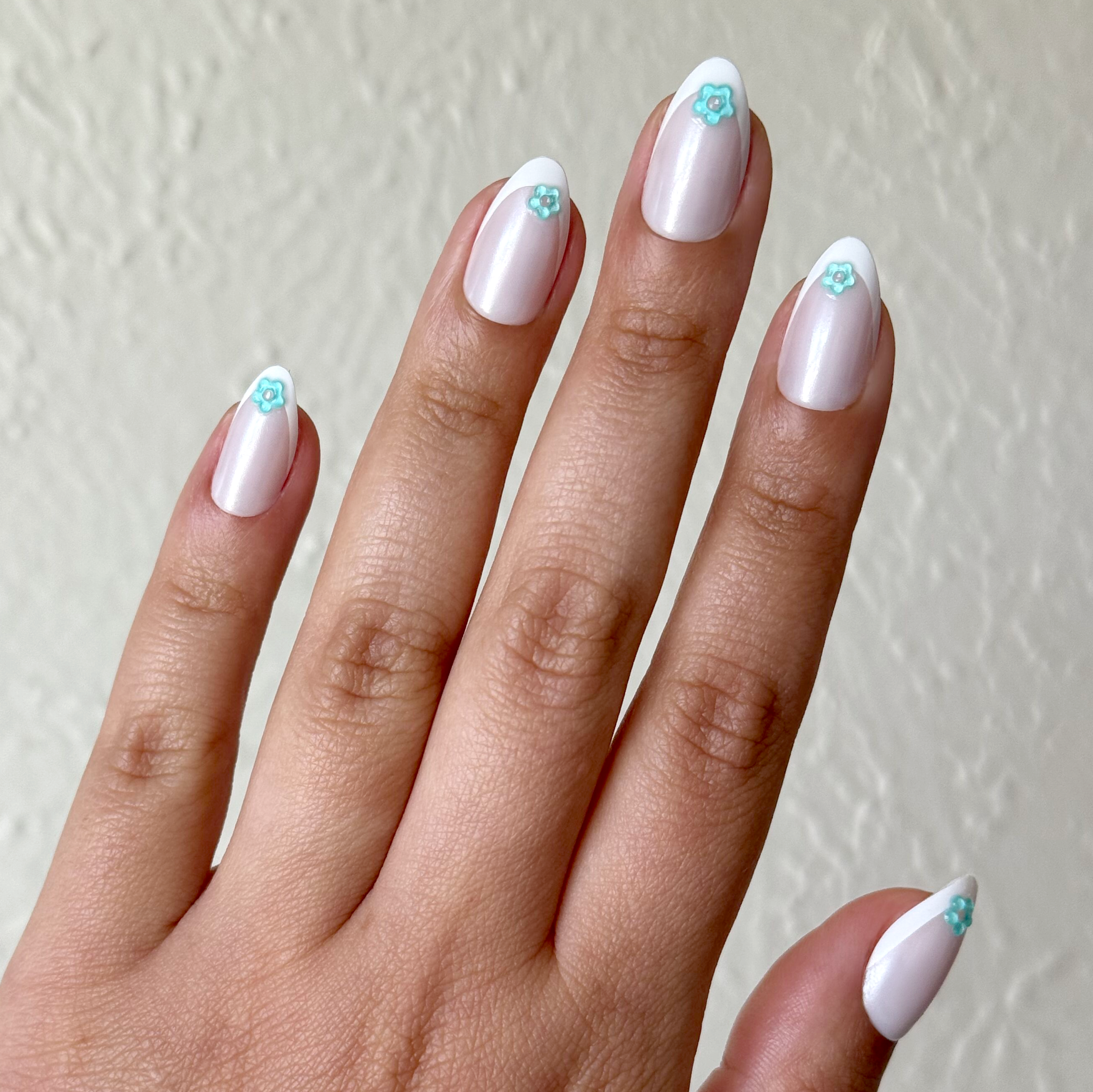 Puffy Flower Chrome French - Press-On | Medium | Almond false nails with white tips and blue floral accents for at-home manicure