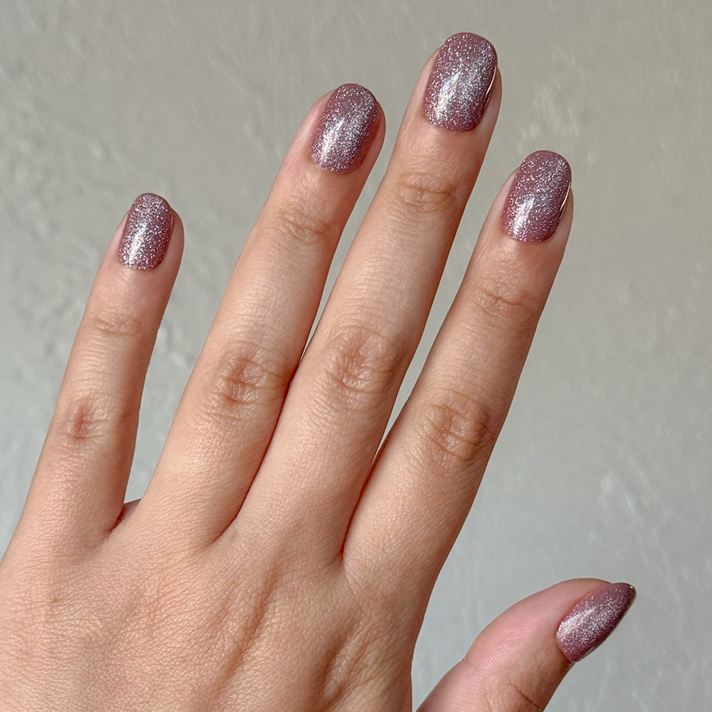 Shacket Velvet | Extra Short | Round - Tab Press-On nails in warm neutral rose with velvet texture on natural hand