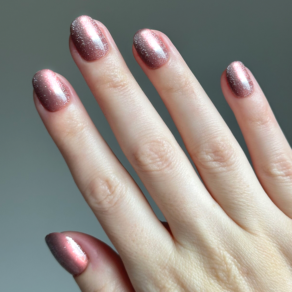 Shacket Velvet | Extra Short | Round - Tab Press-On nails in warm rose with a subtle shimmer on natural hand