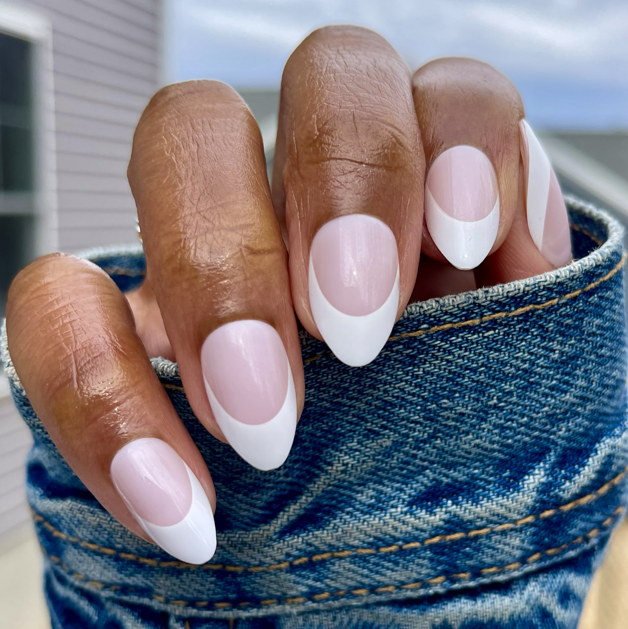 Thick French - Press-On | Medium | Almond showing bold white tips on medium almond-shaped false nails for at-home mani