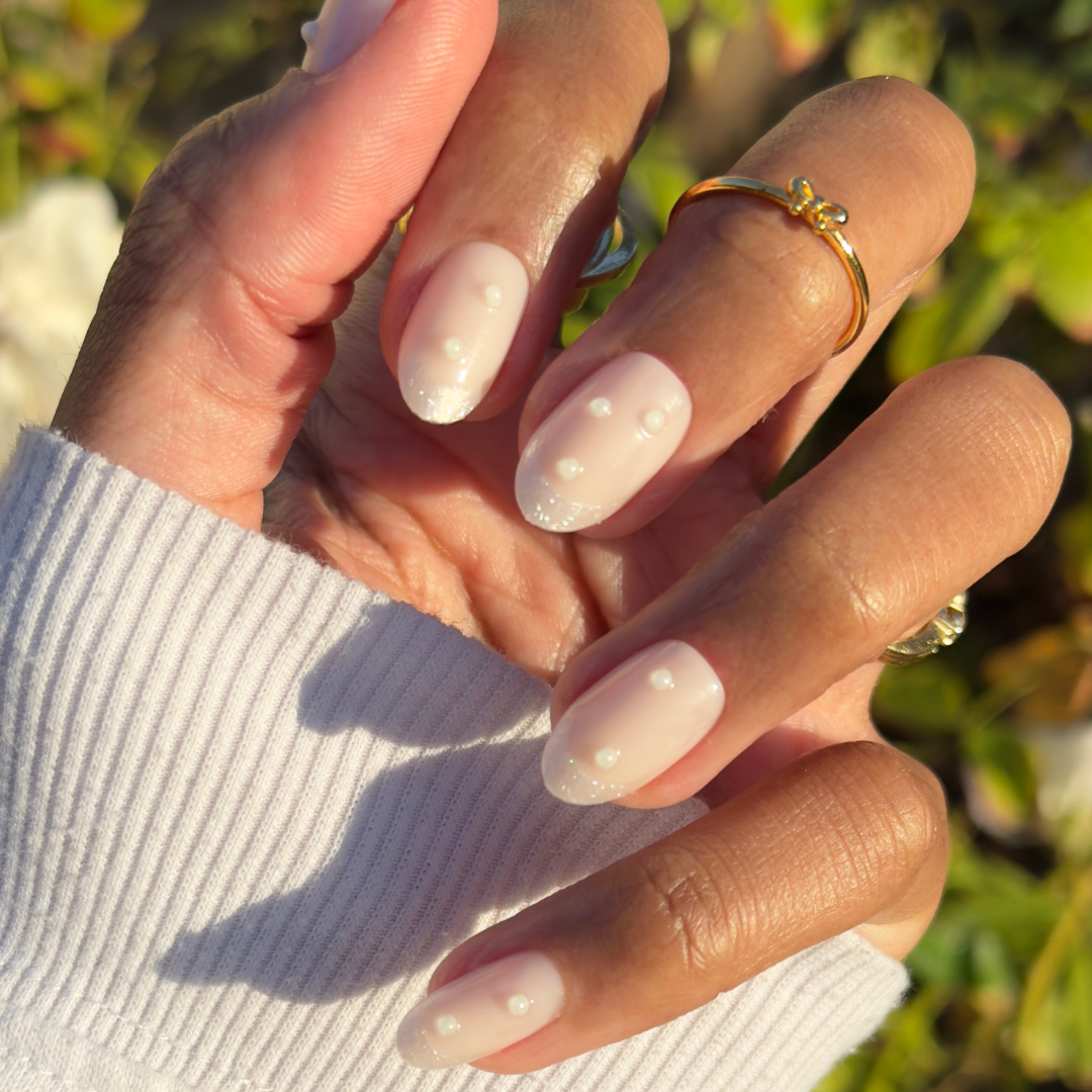 True Pearl French - Press-On | Medium | Oval showing soft pearly nails adorned with 3D mini pearls for a refined manicure look